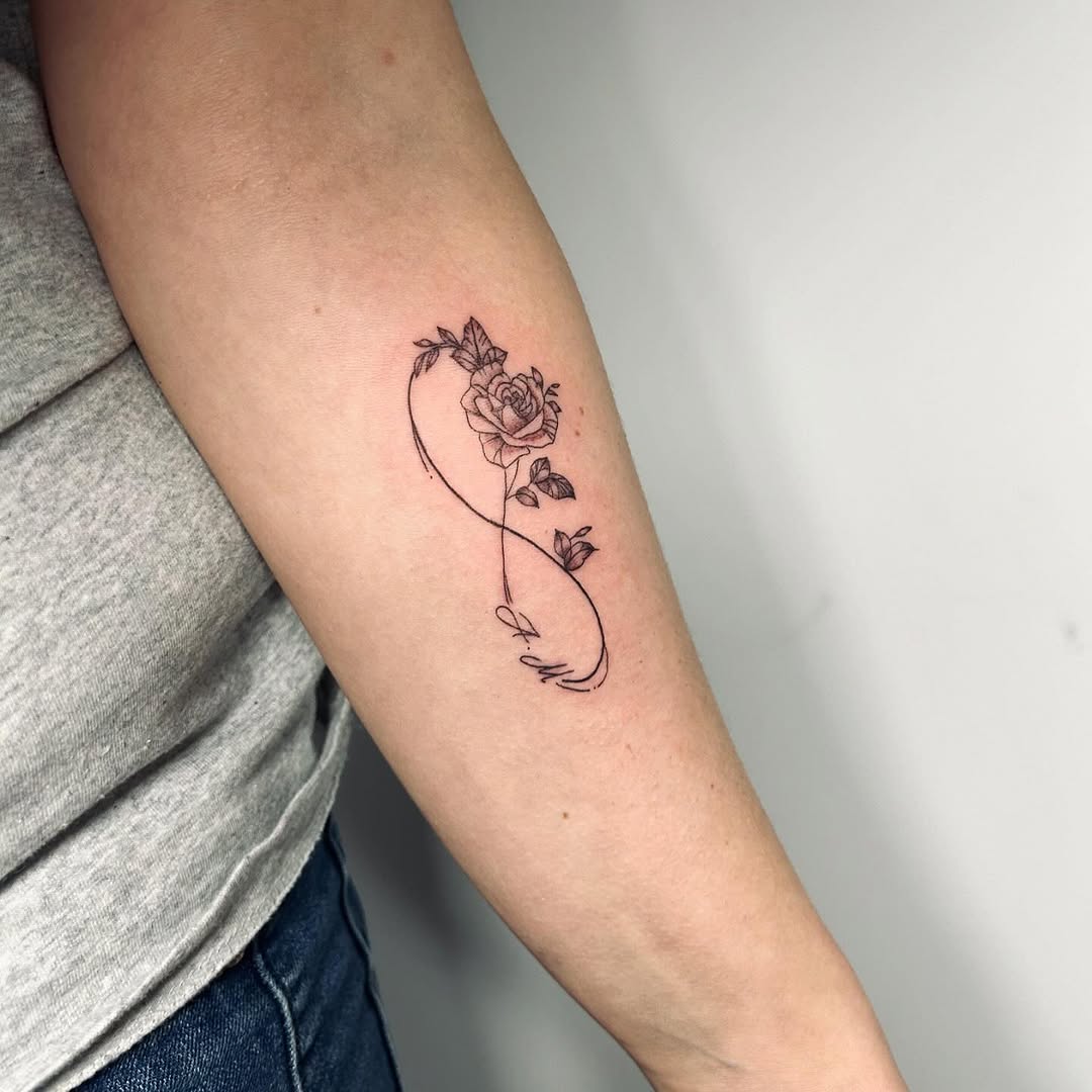 Delicate infinity rose tattoo design
