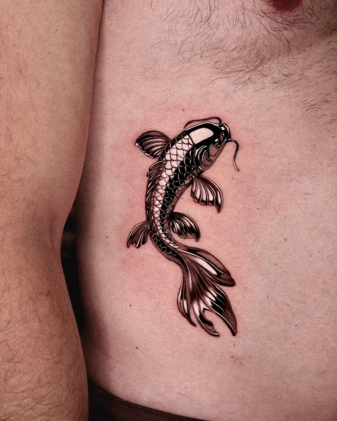 Beautifully detailed koi fish tattoo on side