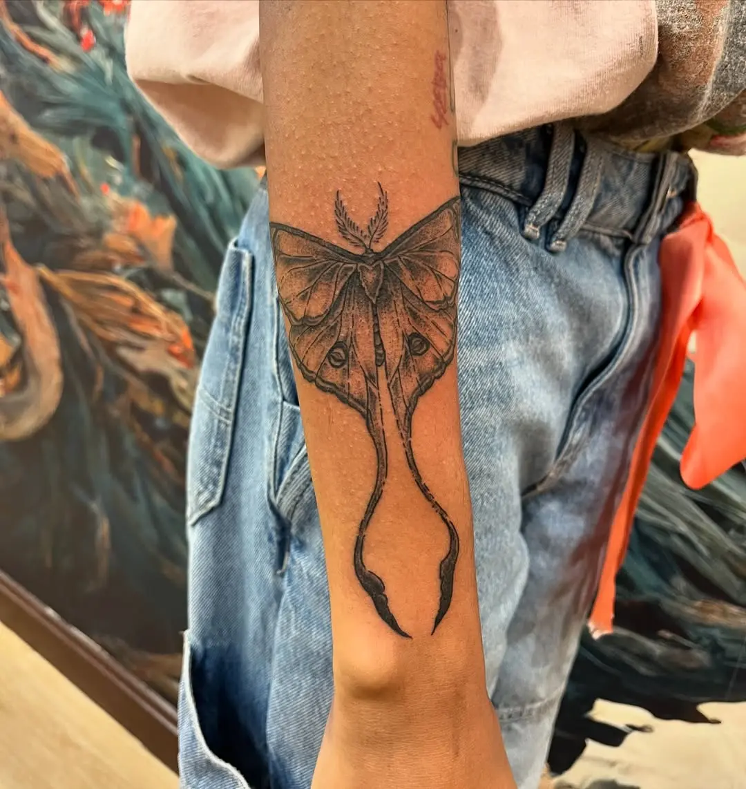 Detailed and unique moth tattoo design.