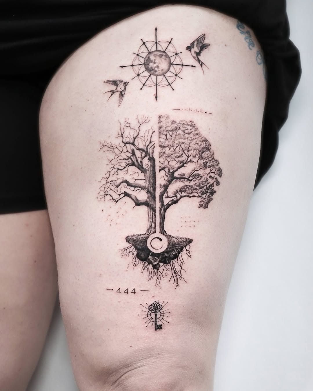 Symbolic tree of life tattoo design on thigh