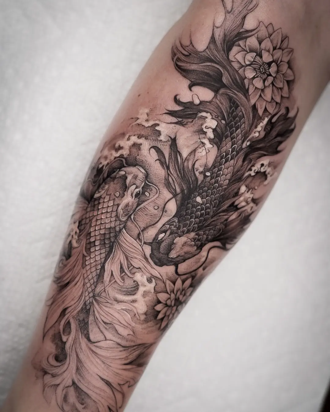 Intricate koi fish tattoo with flowing waves