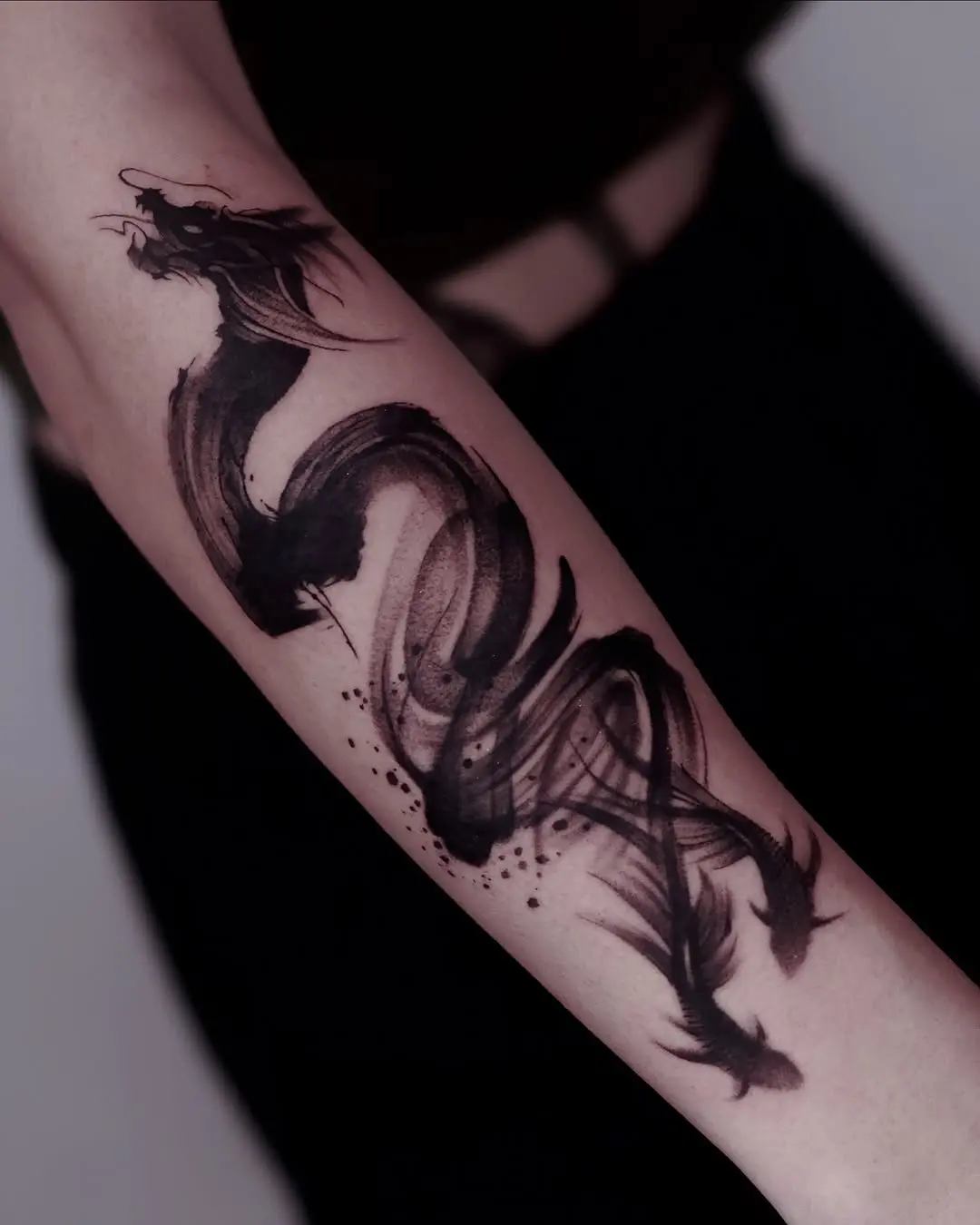 Flowing black ink koi fish tattoo design