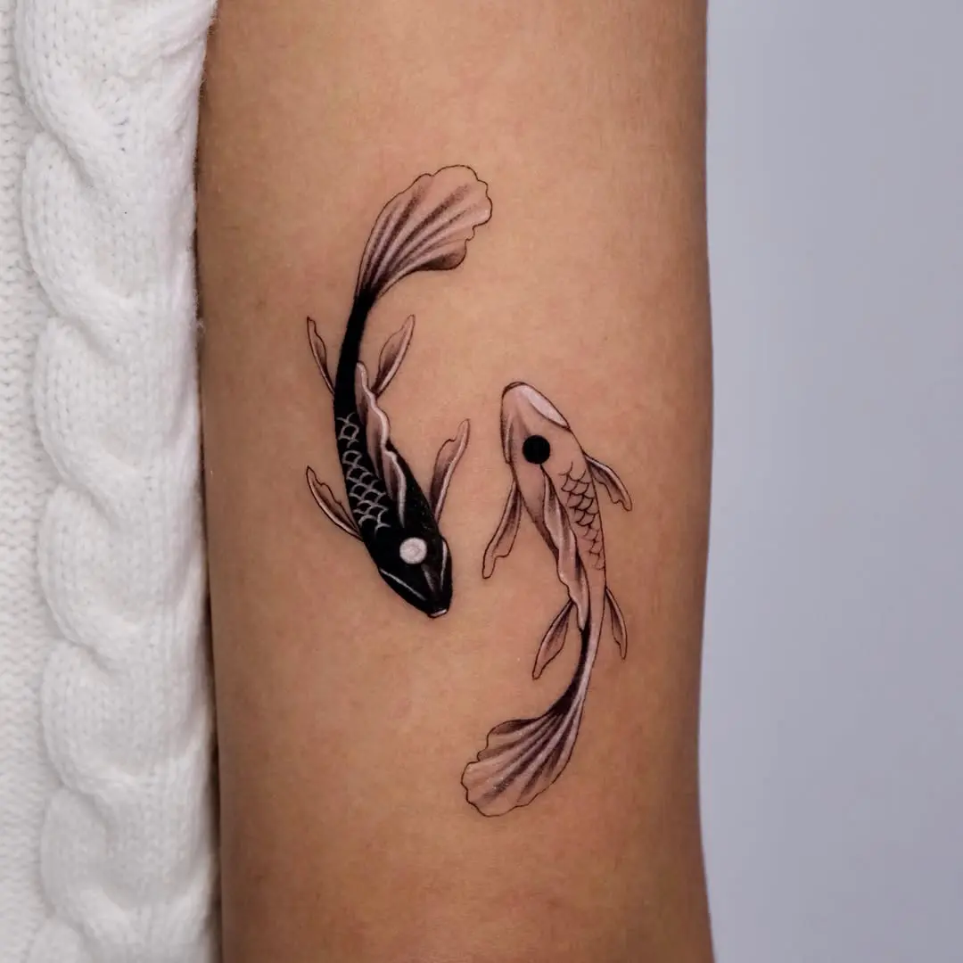 Elegant black and white koi fish tattoos