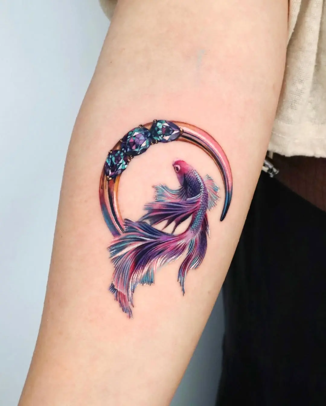 Artistic koi fish tattoo with gemstone accents