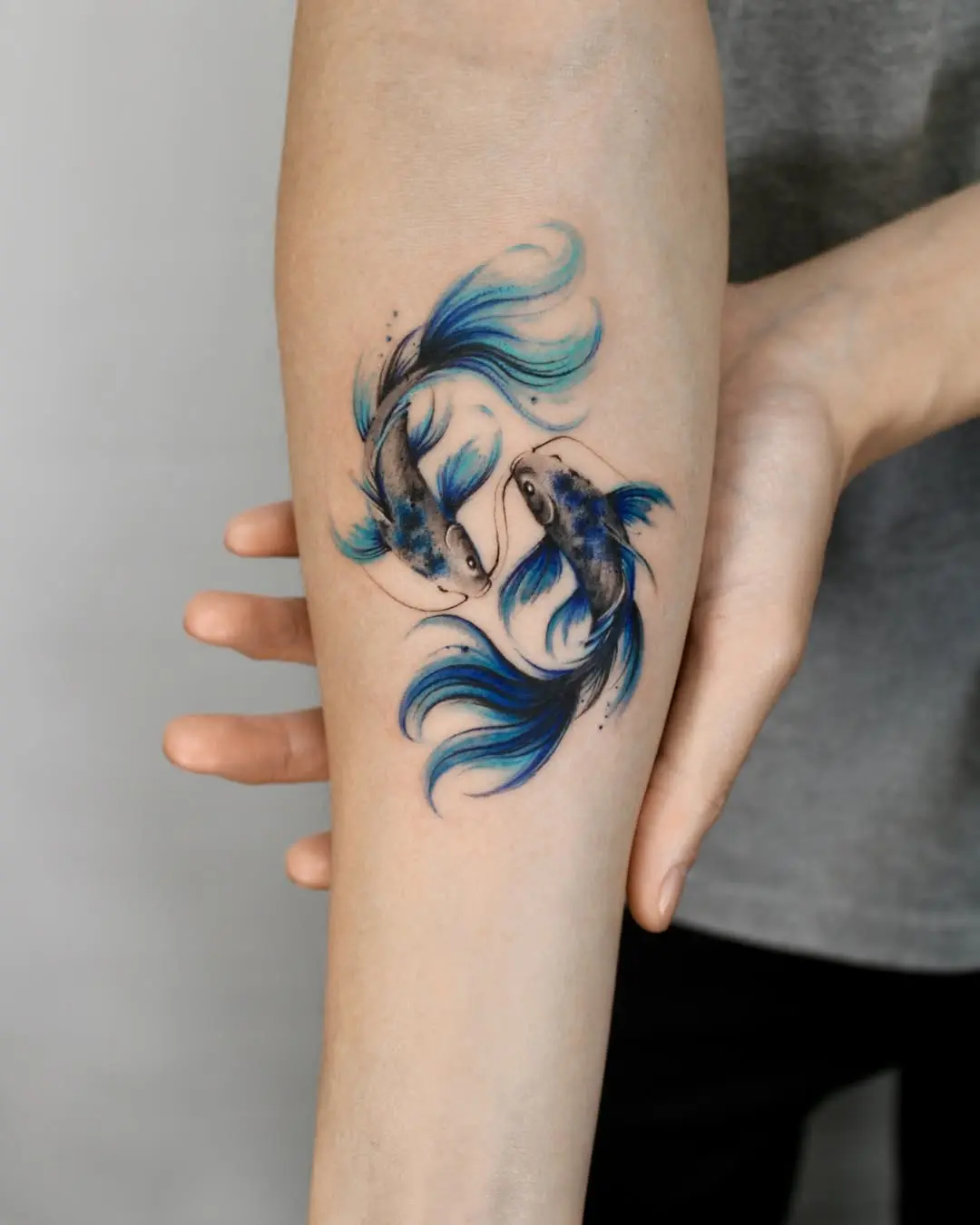 Stylish koi fish tattoo with vibrant blue hues