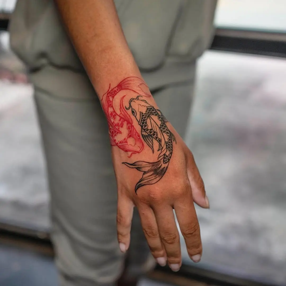 Intricate koi fish tattoo blending vibrant colors