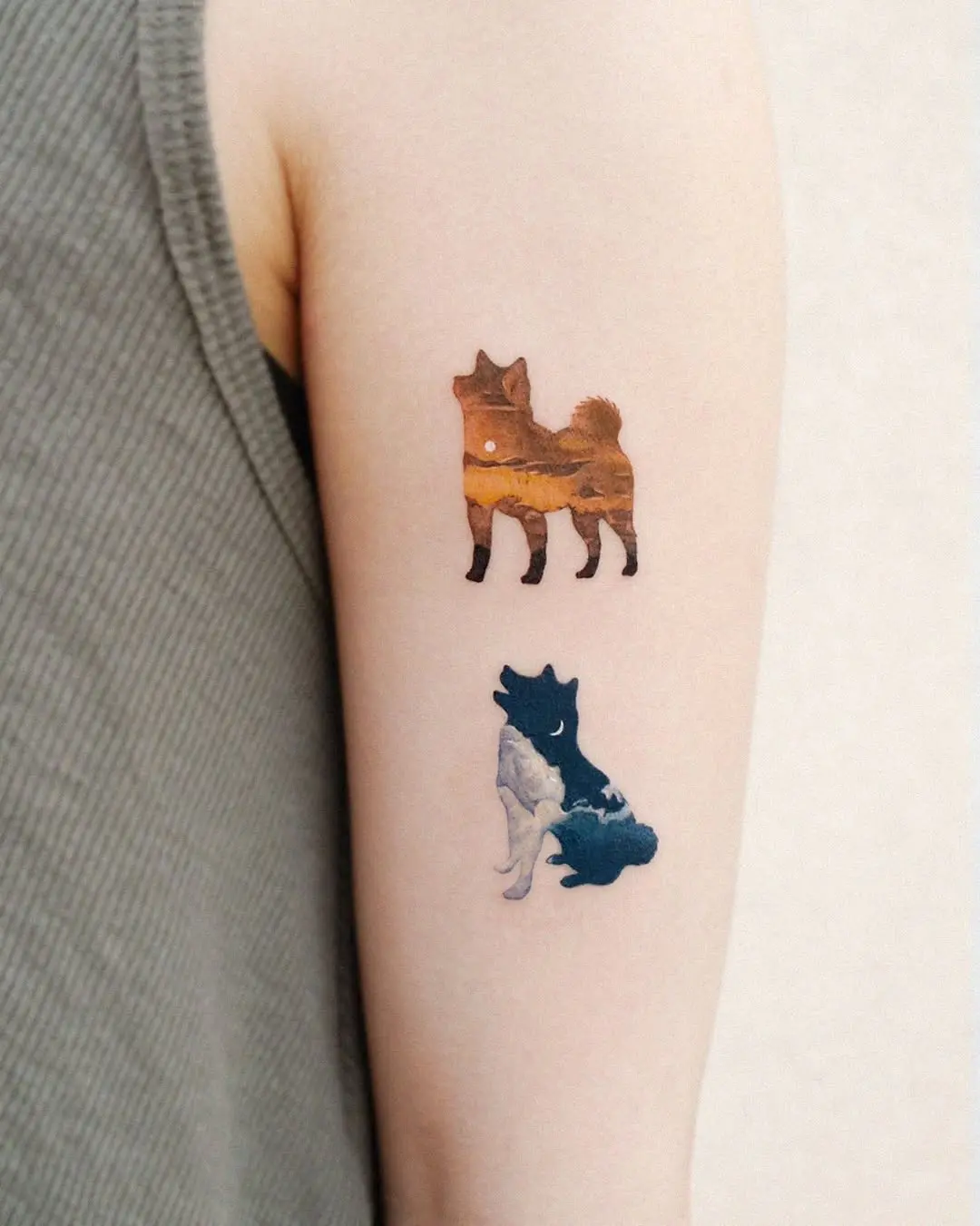Nature-inspired canine tattoos on a lovely arm