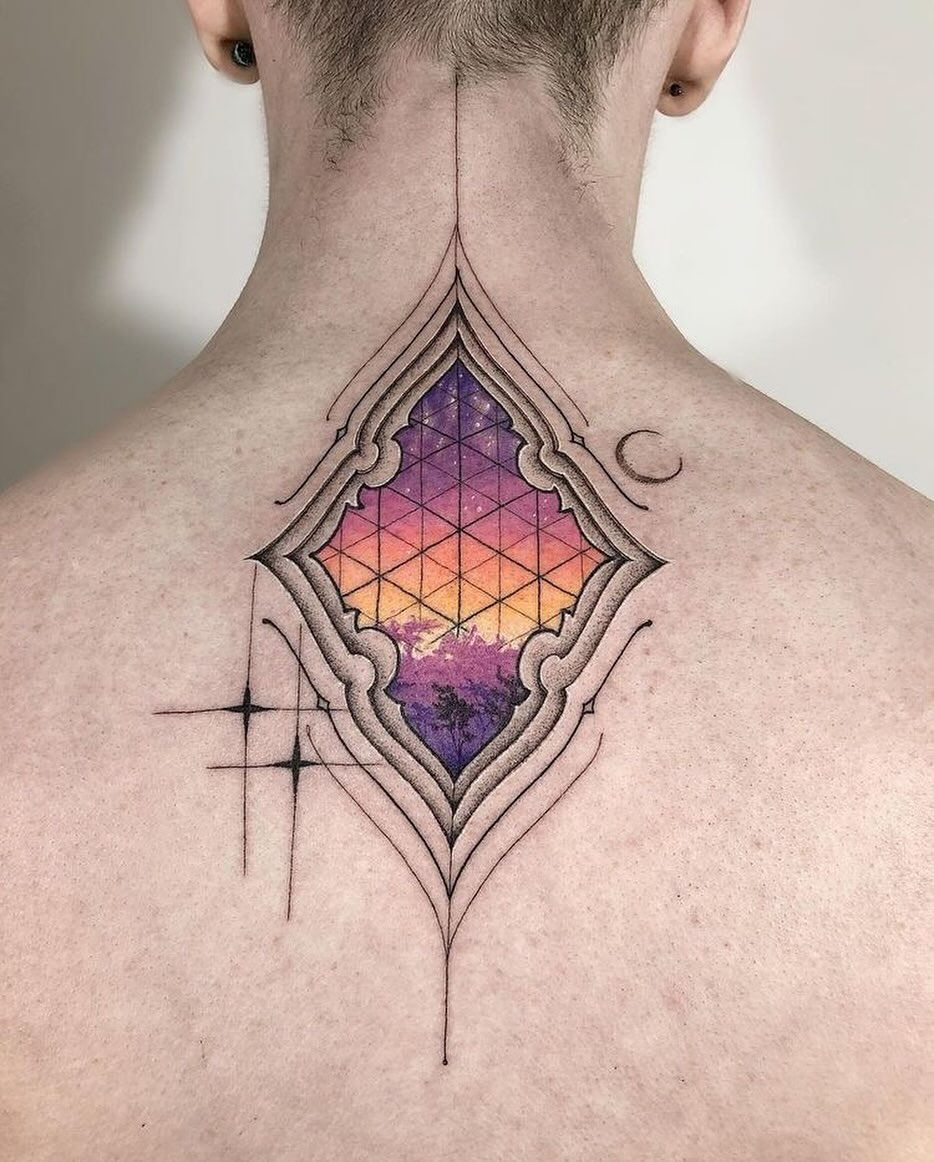 Geometric landscape tattoo with vibrant colors