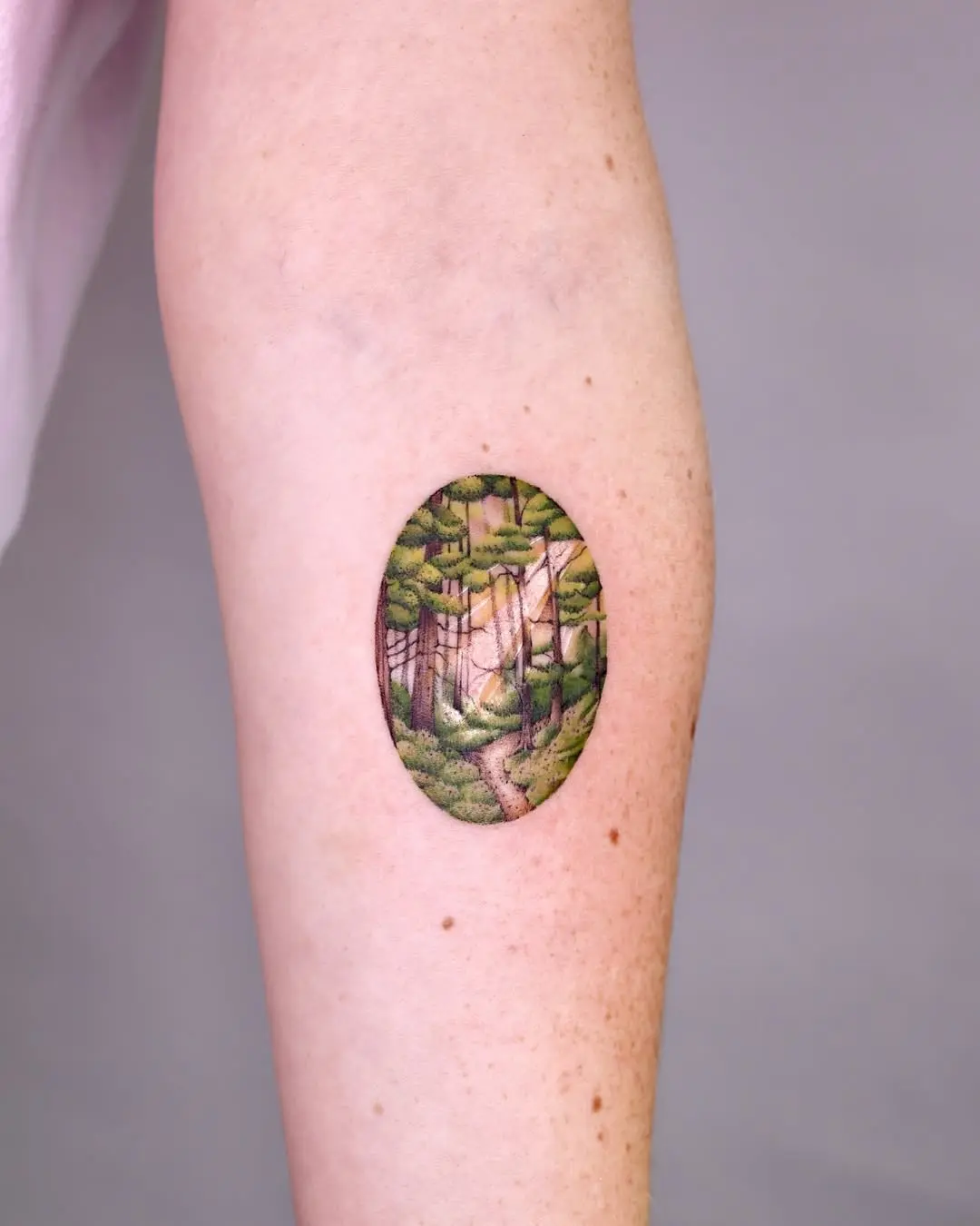 A serene forest path tattoo design.