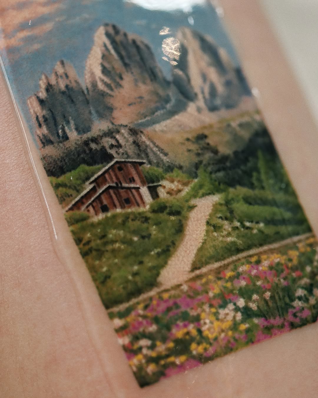 Serene landscape tattoo with vibrant nature details