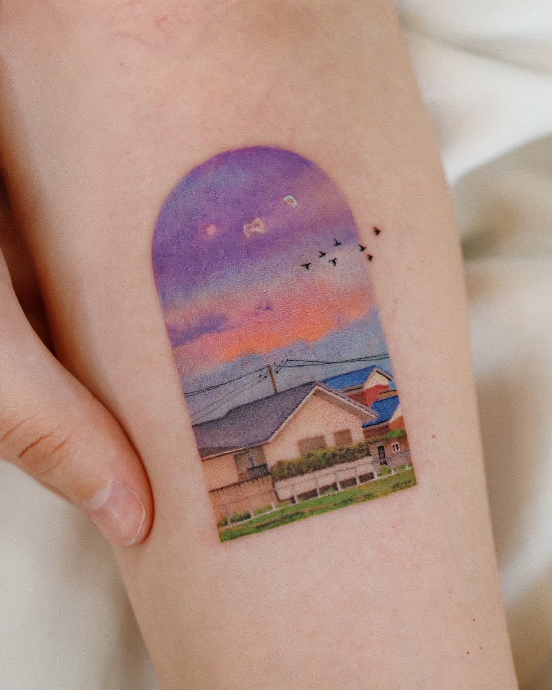 A vibrant sunset landscape tattoo design