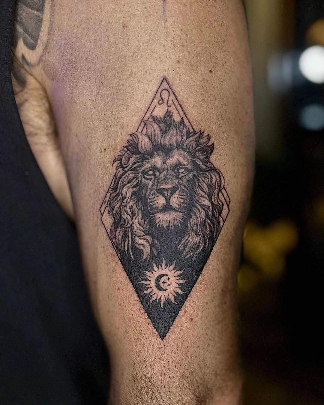 Majestic lion tattoo with geometric design