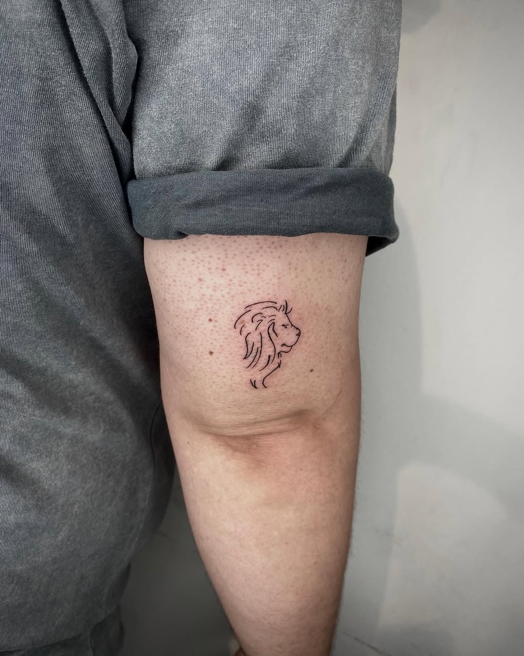 Elegant Minimal Lion Tattoo for Leos