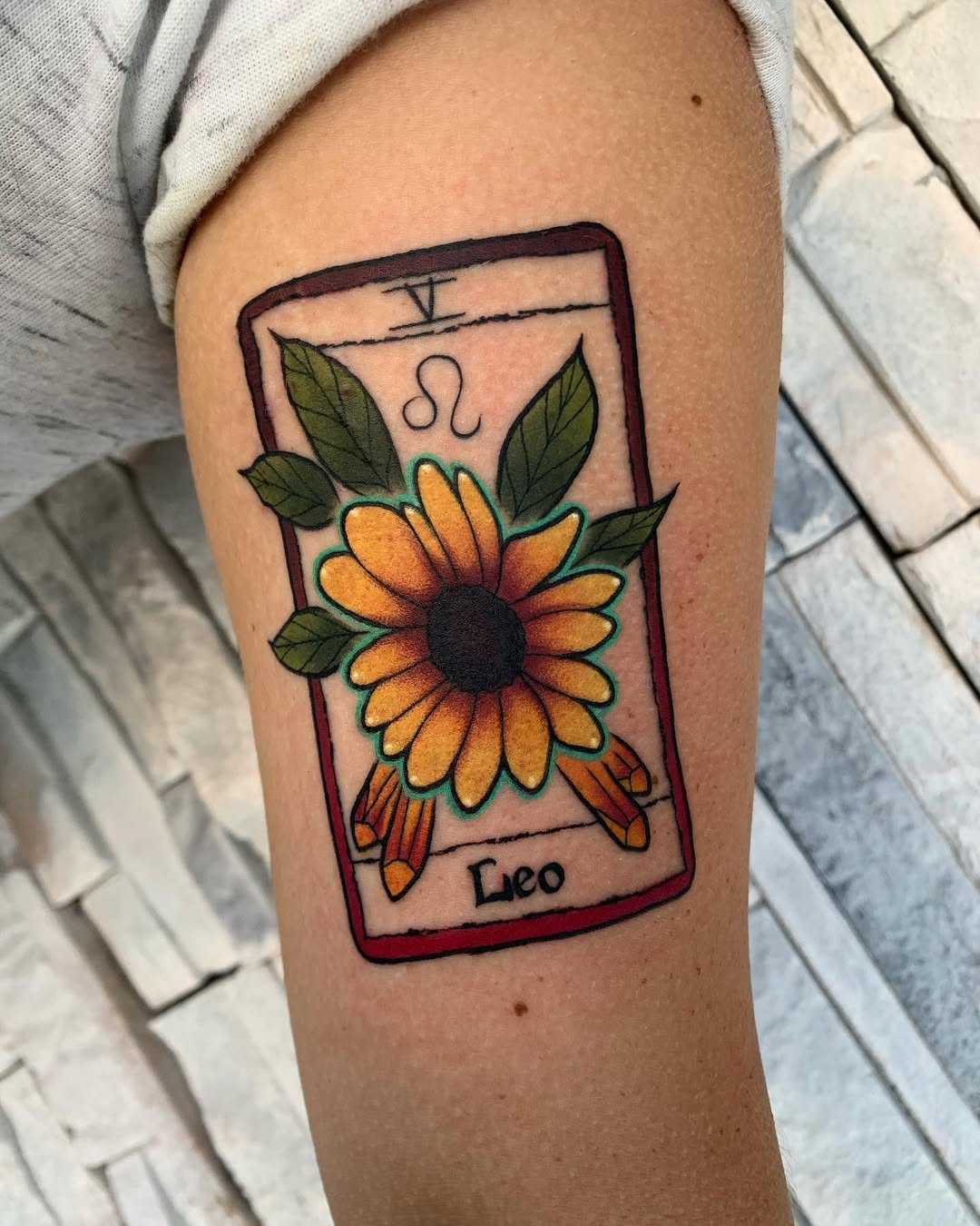 A vibrant Leo tarot card tattoo design