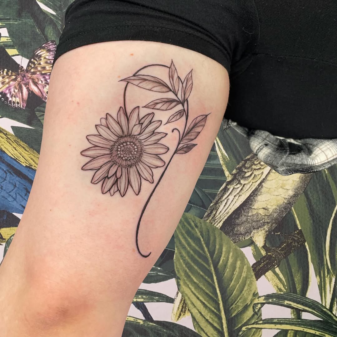 Stylish sunflower tattoo with elegant lines