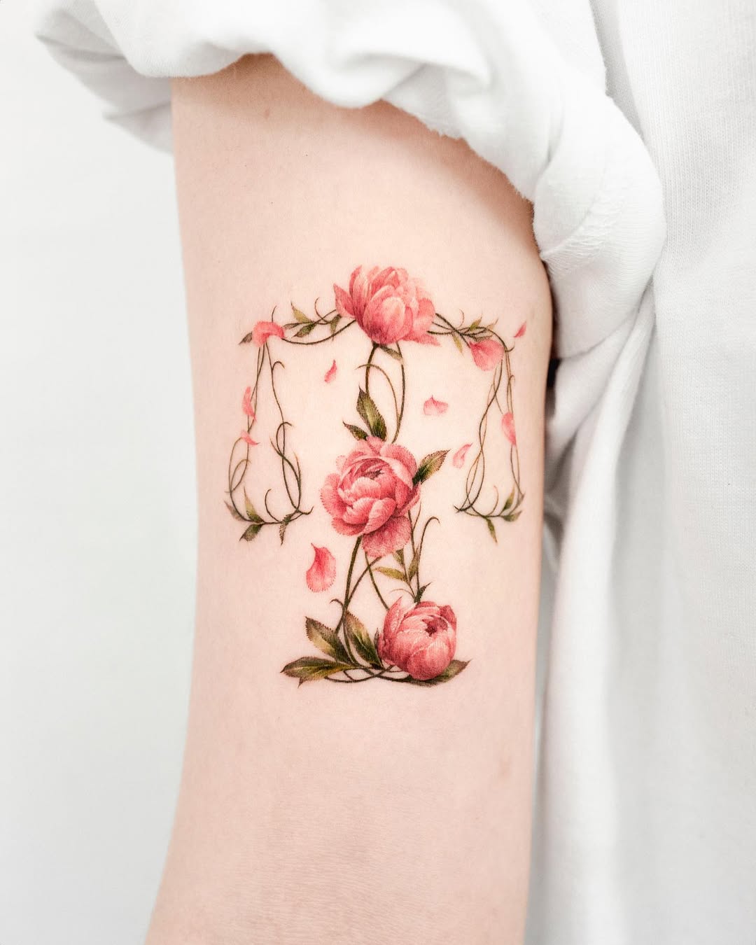 Elegant floral Libra tattoo design for balance