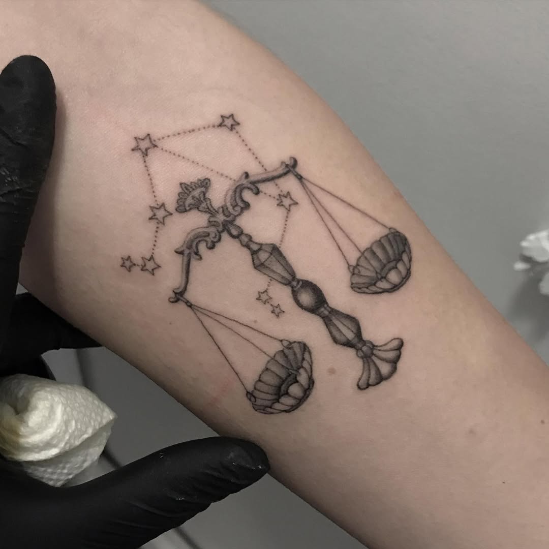 Elegant Libra tattoo with celestial elements