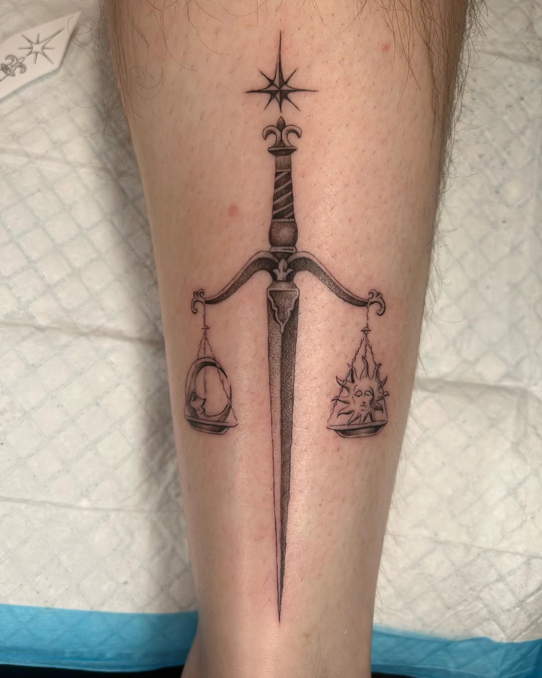 Elegant Libra Tattoo Featuring Scales and Sword