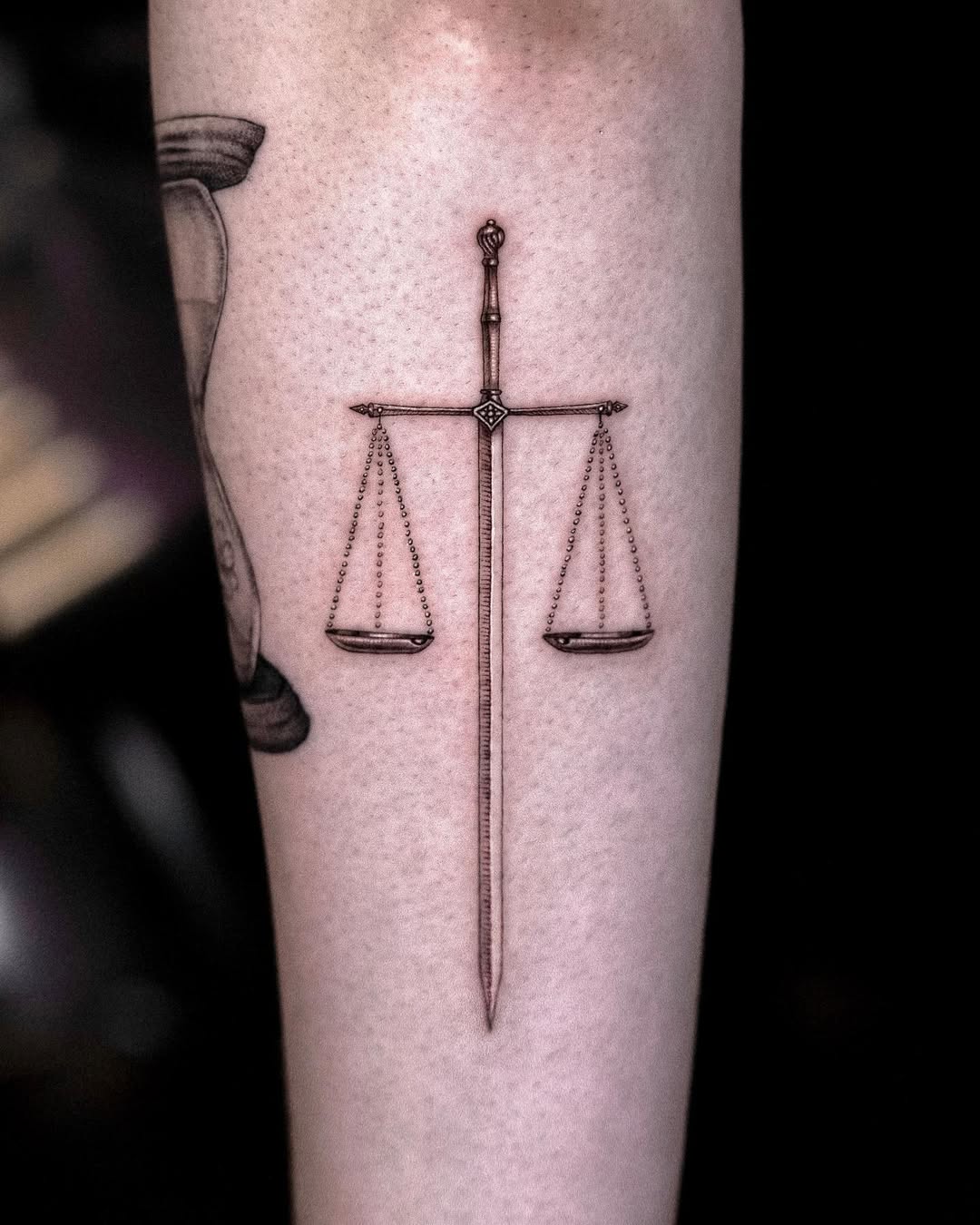 Elegant Libra Symbol Blending Sword and Scales