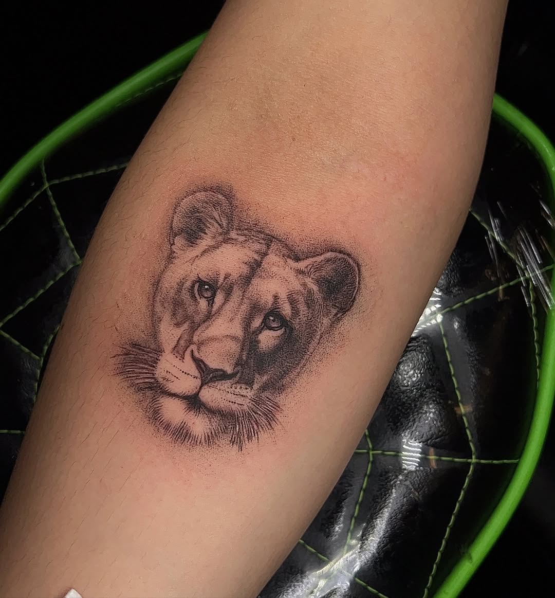 Stunning realistic lion tattoo design on arm