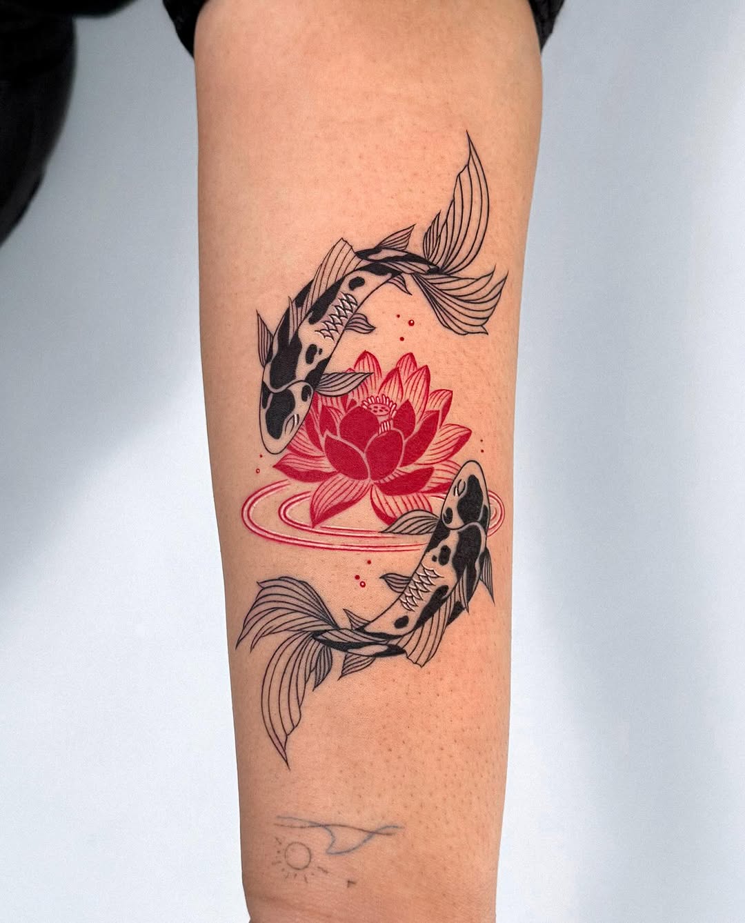 Koi fish with vibrant lotus floral design