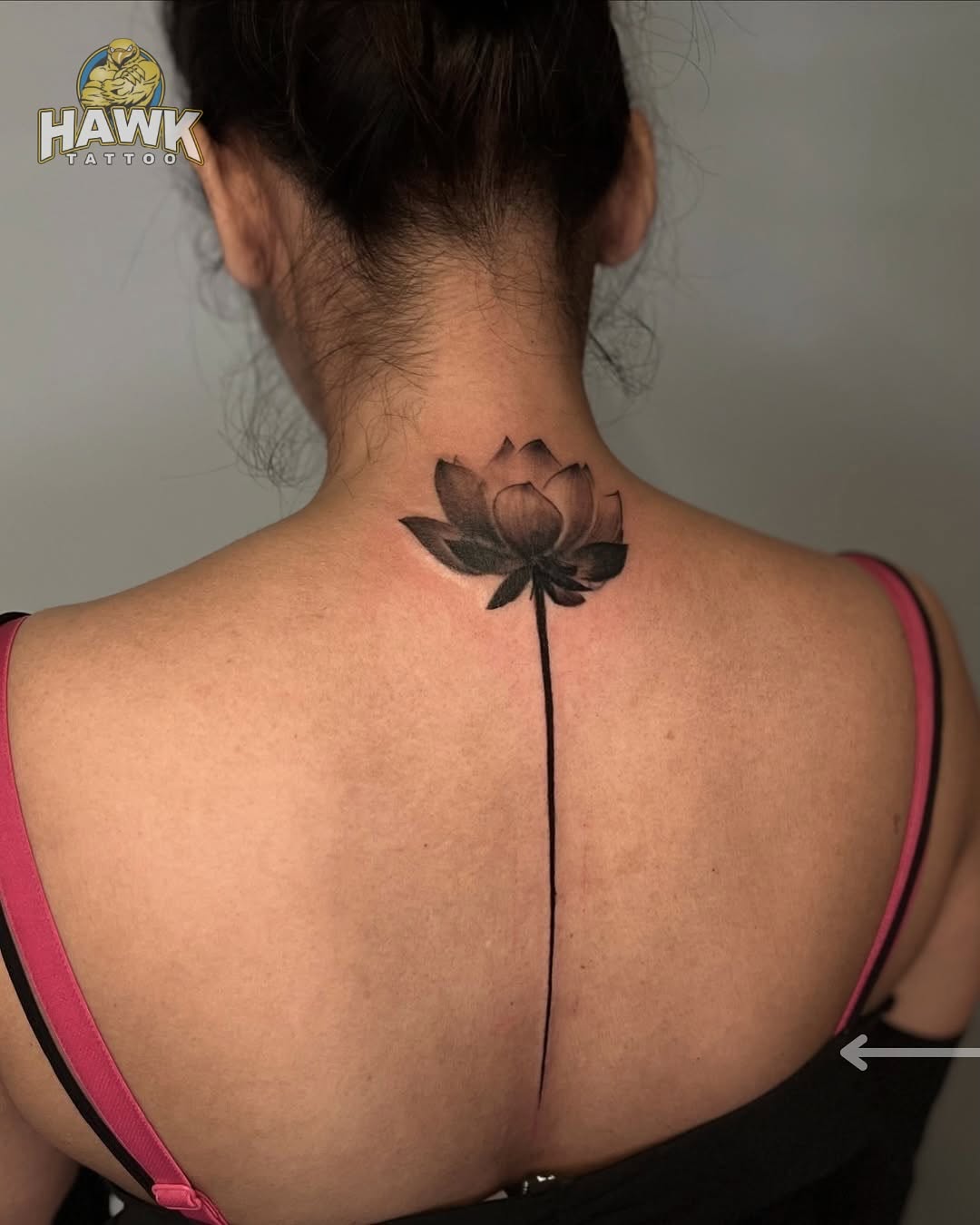 Elegant lotus tattoo on the back