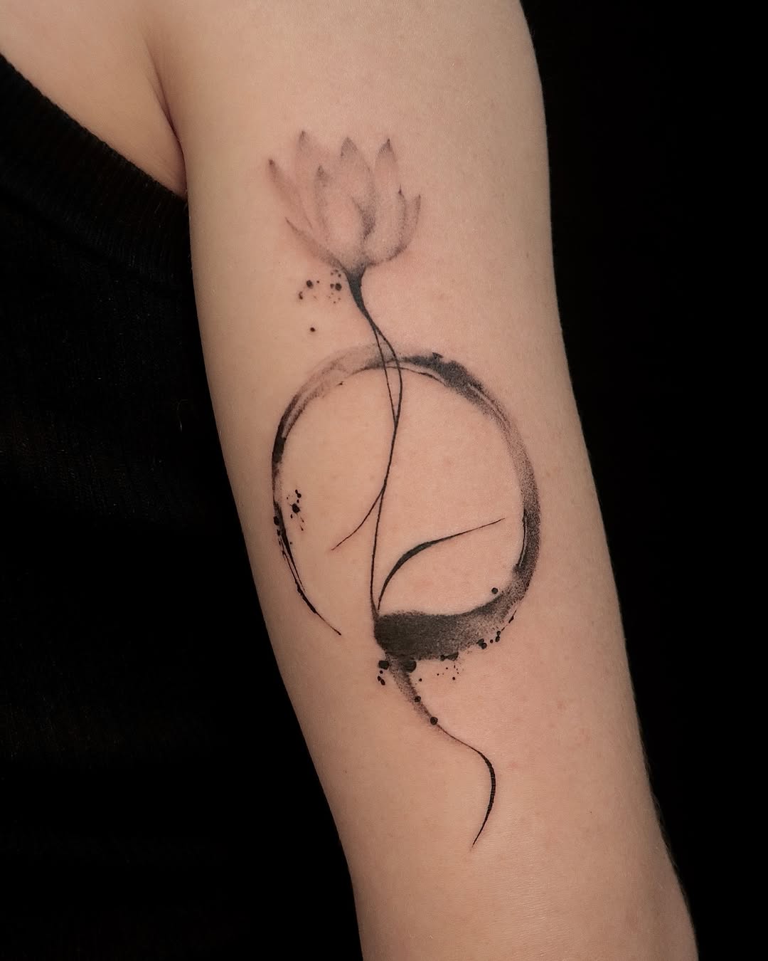 Elegant lotus tattoo with minimalist design