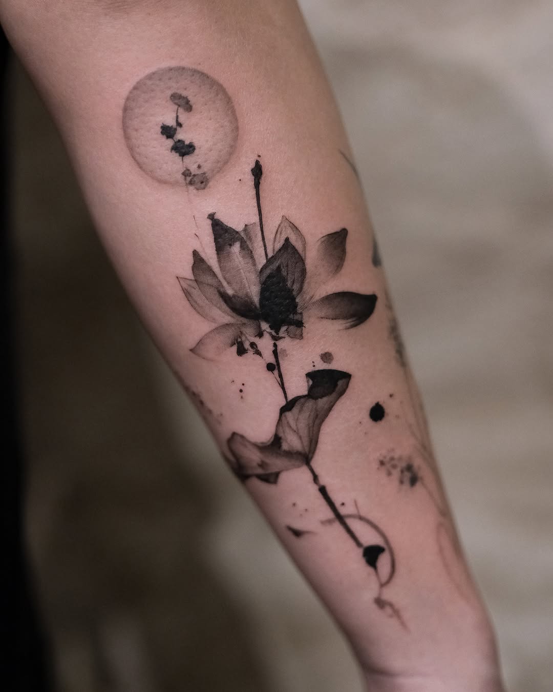 Elegant black and grey lotus tattoo design