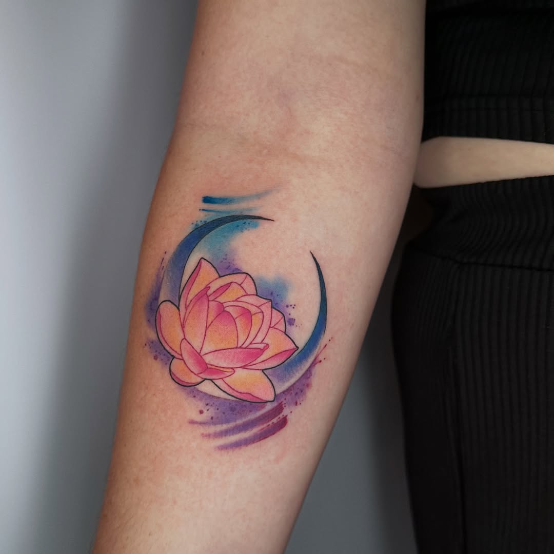 Vibrant lotus tattoo with watercolor elements