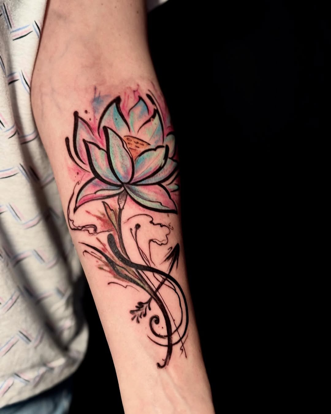 Vibrant lotus tattoo with flowing elegance