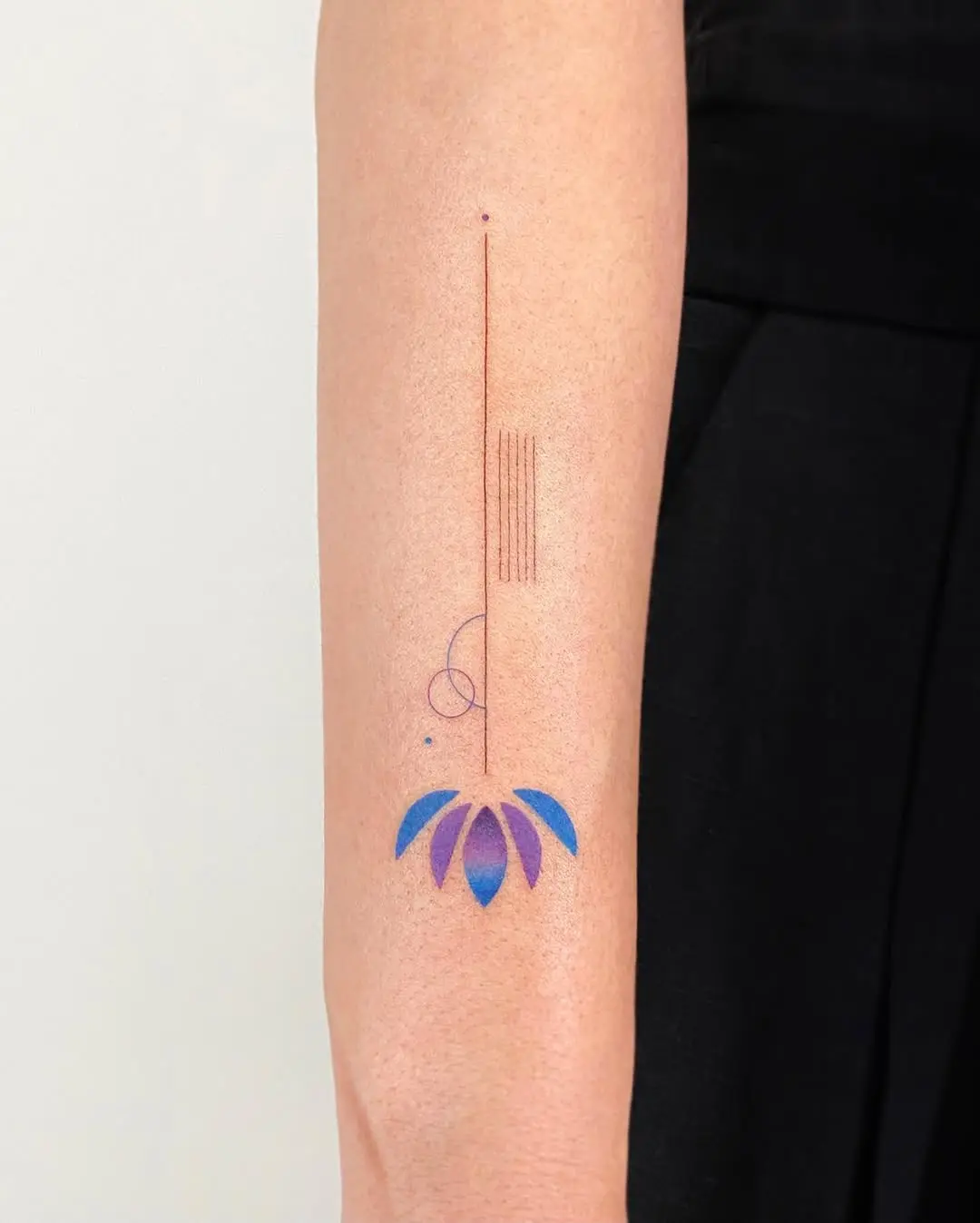 Minimalistic colorful lotus tattoo design