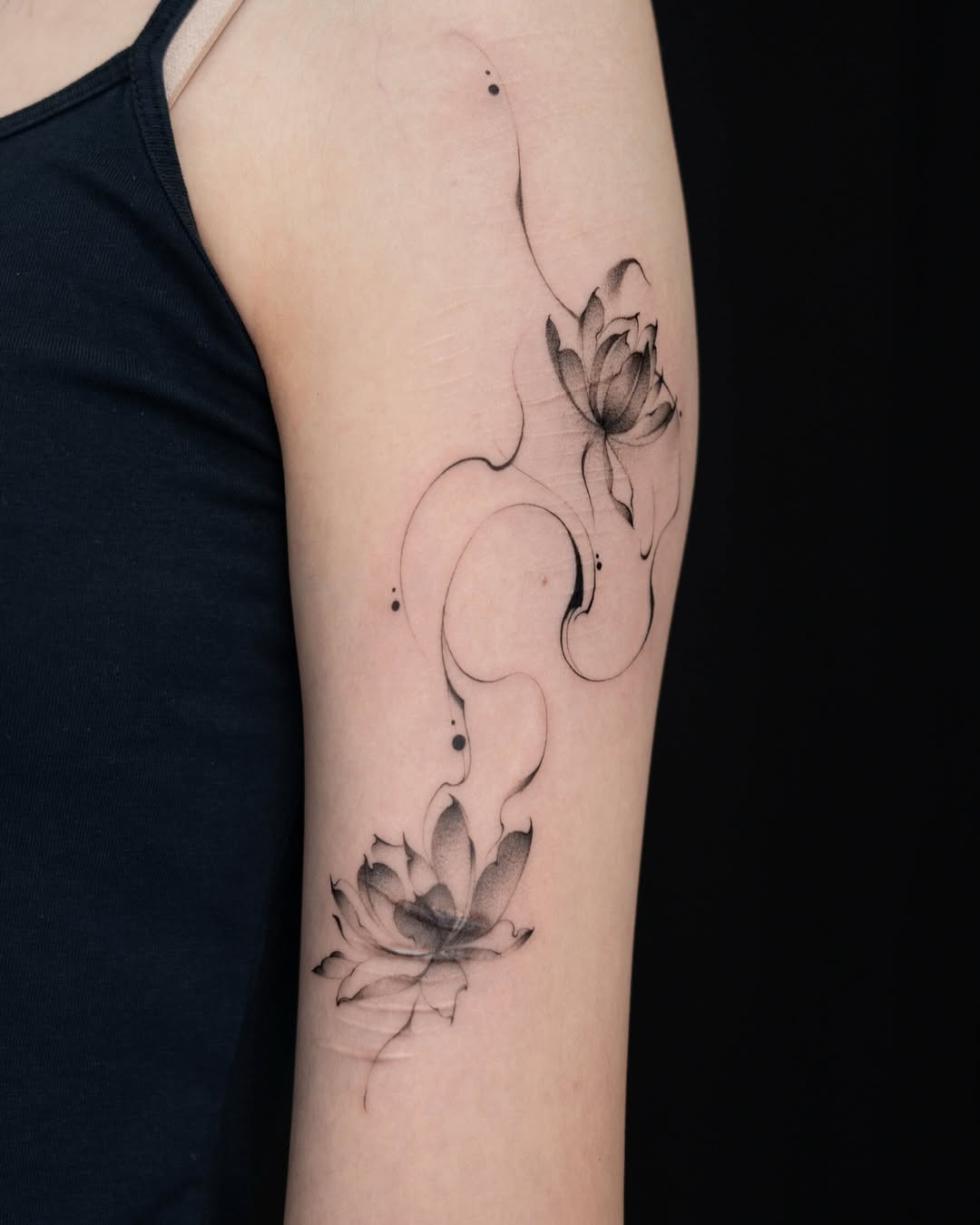 Stylish black and white lotus tattoo design