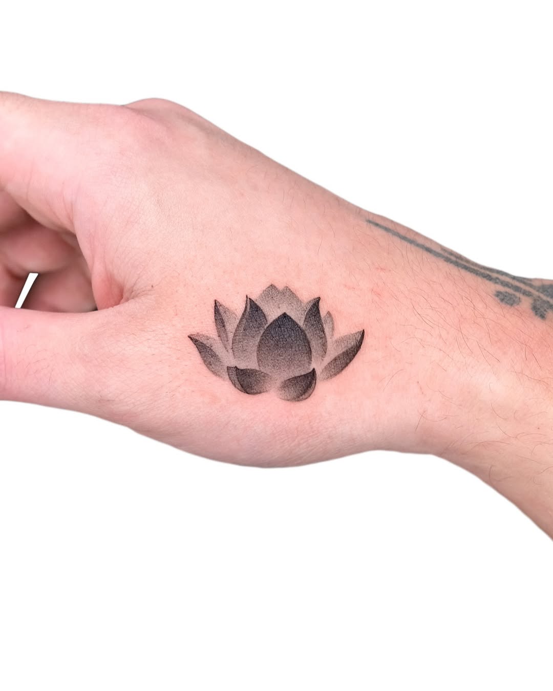 Elegant black and gray lotus flower tattoo design