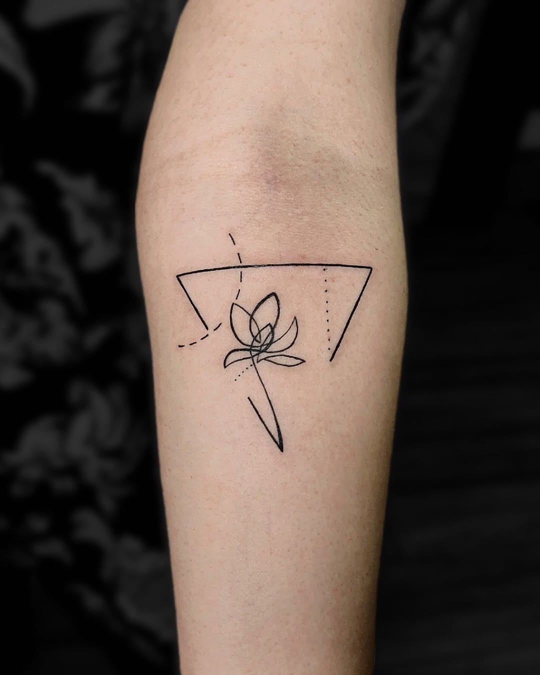 Elegant minimalist lotus tattoo design