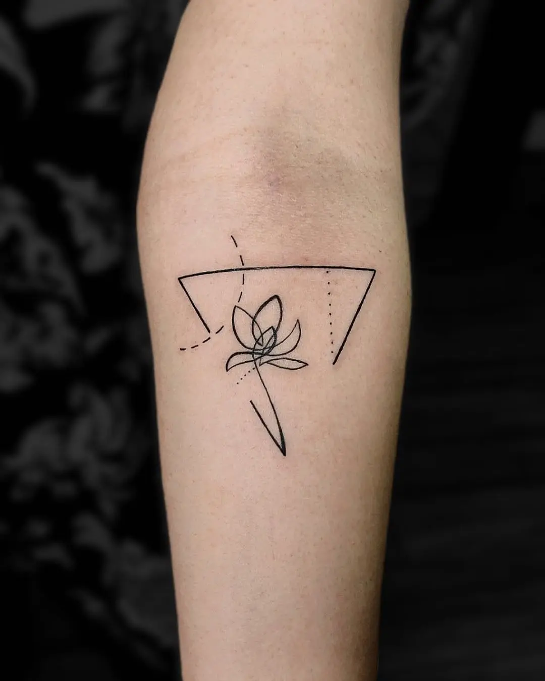 Elegant minimalist lotus tattoo design