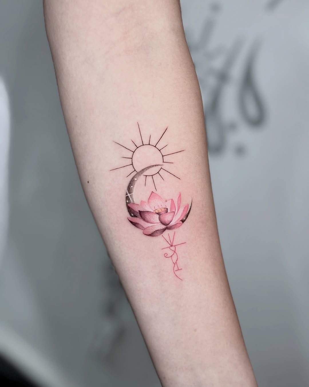 Elegant lotus tattoo with sun and moon elements