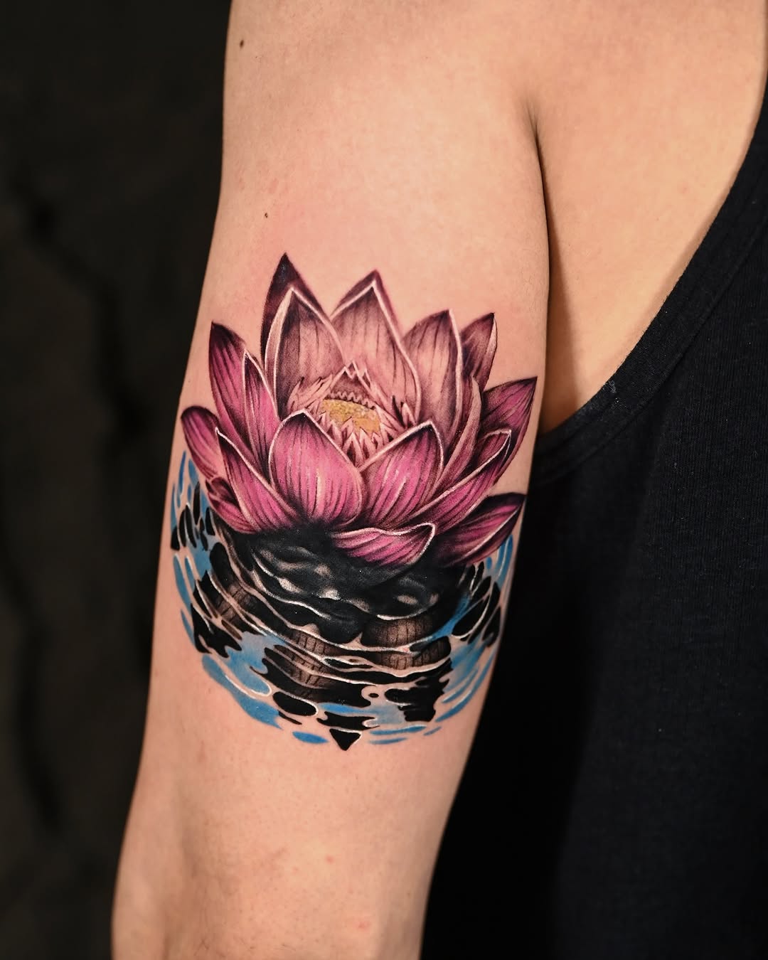 A stunning lotus tattoo bursting with color