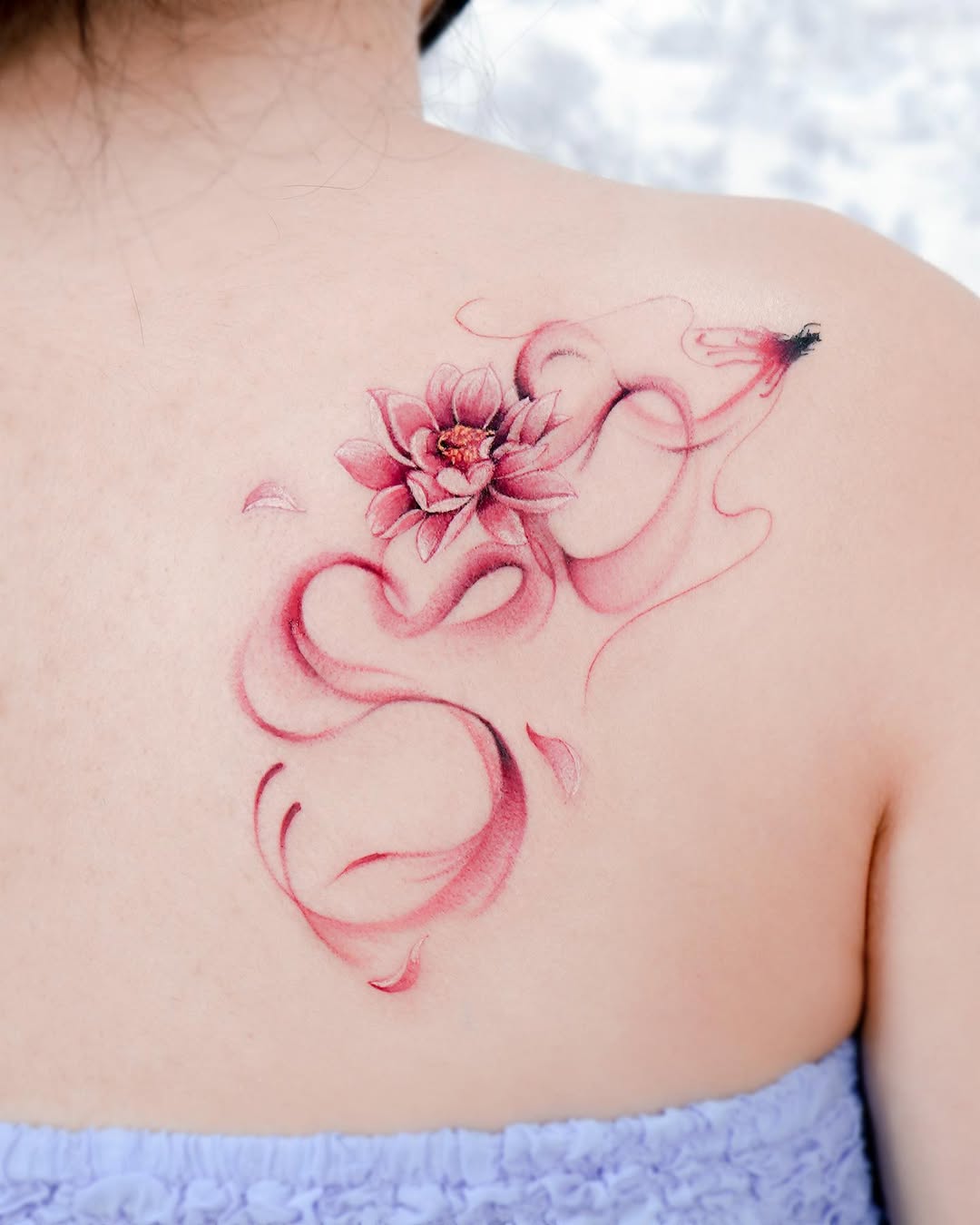 Elegant lotus tattoo with flowing design