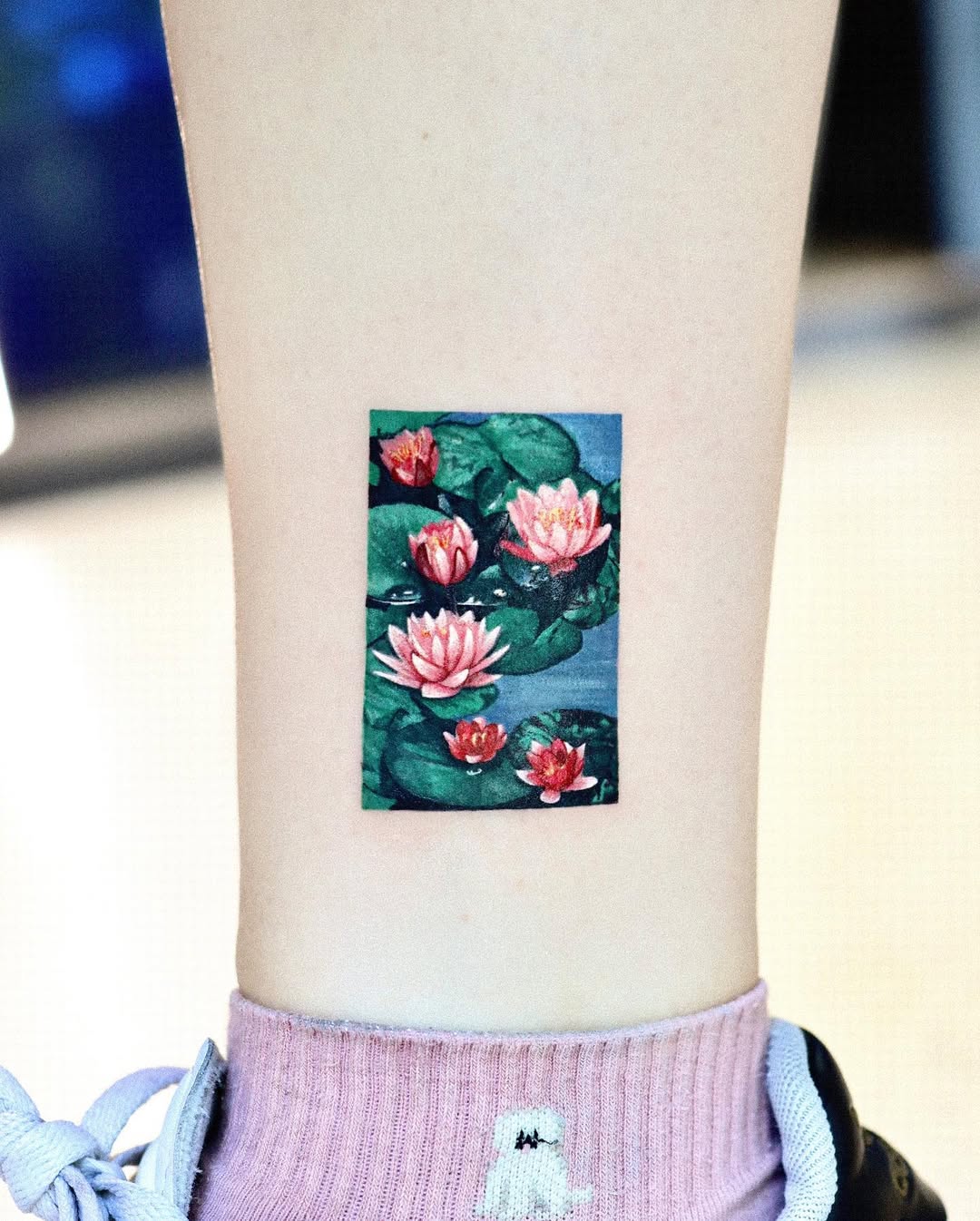 Stunning Lotus Tattoo with Water Lilies Design
