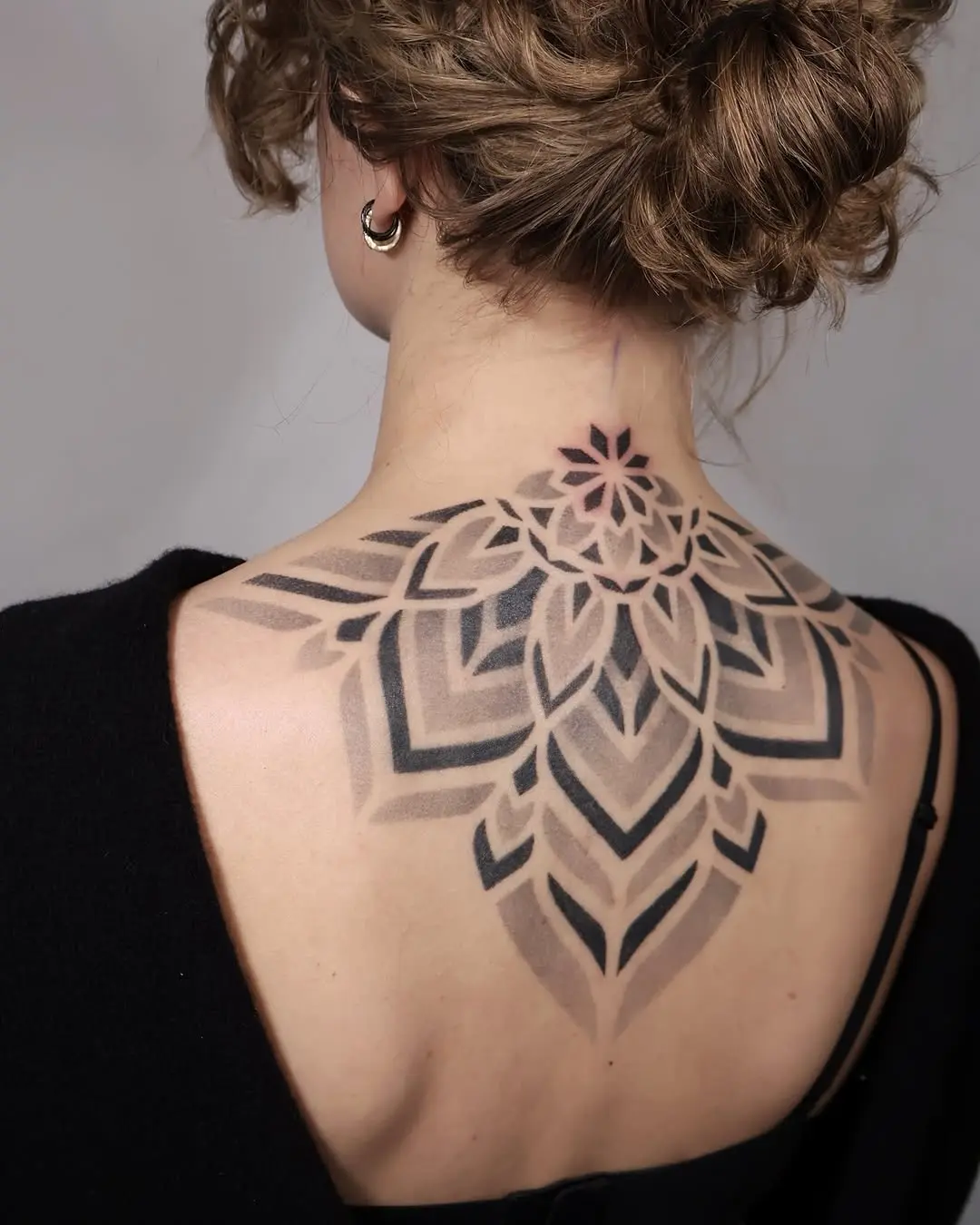 Stunning Mandala Tattoo Gracing the Back