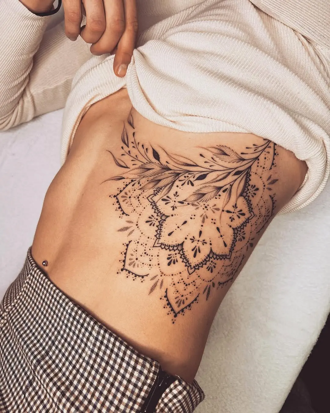 Intricate floral mandala tattoo on side body