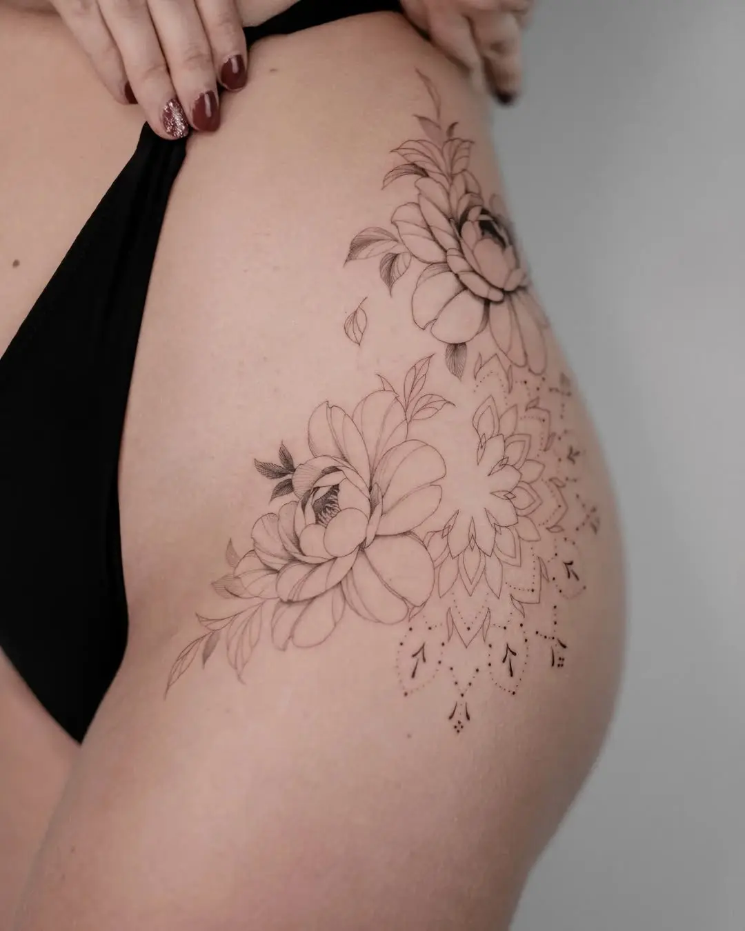 Beautiful floral mandala tattoo on thigh