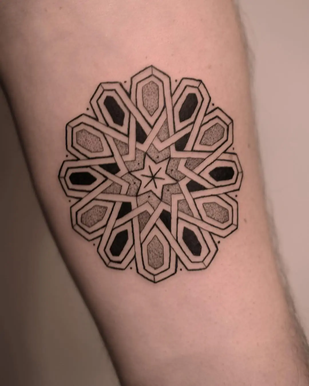 Intricate mandala tattoo featuring geometric patterns
