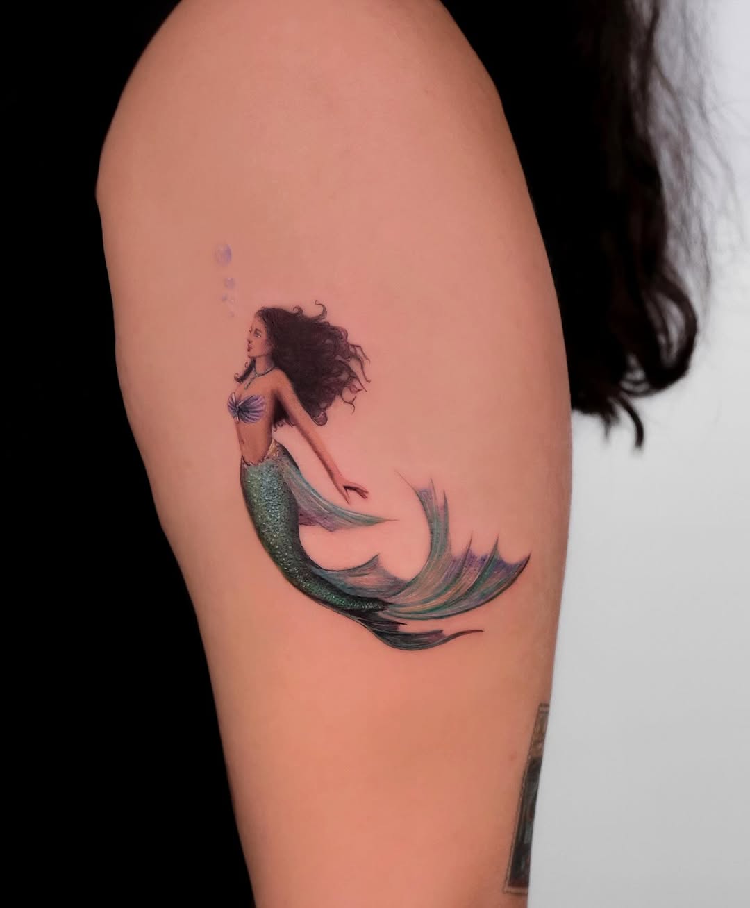 Elegant mermaid tattoo with vibrant colors