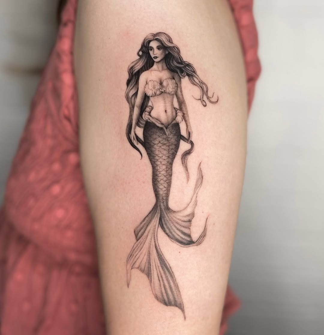 Elegant mermaid tattoo with intricate details