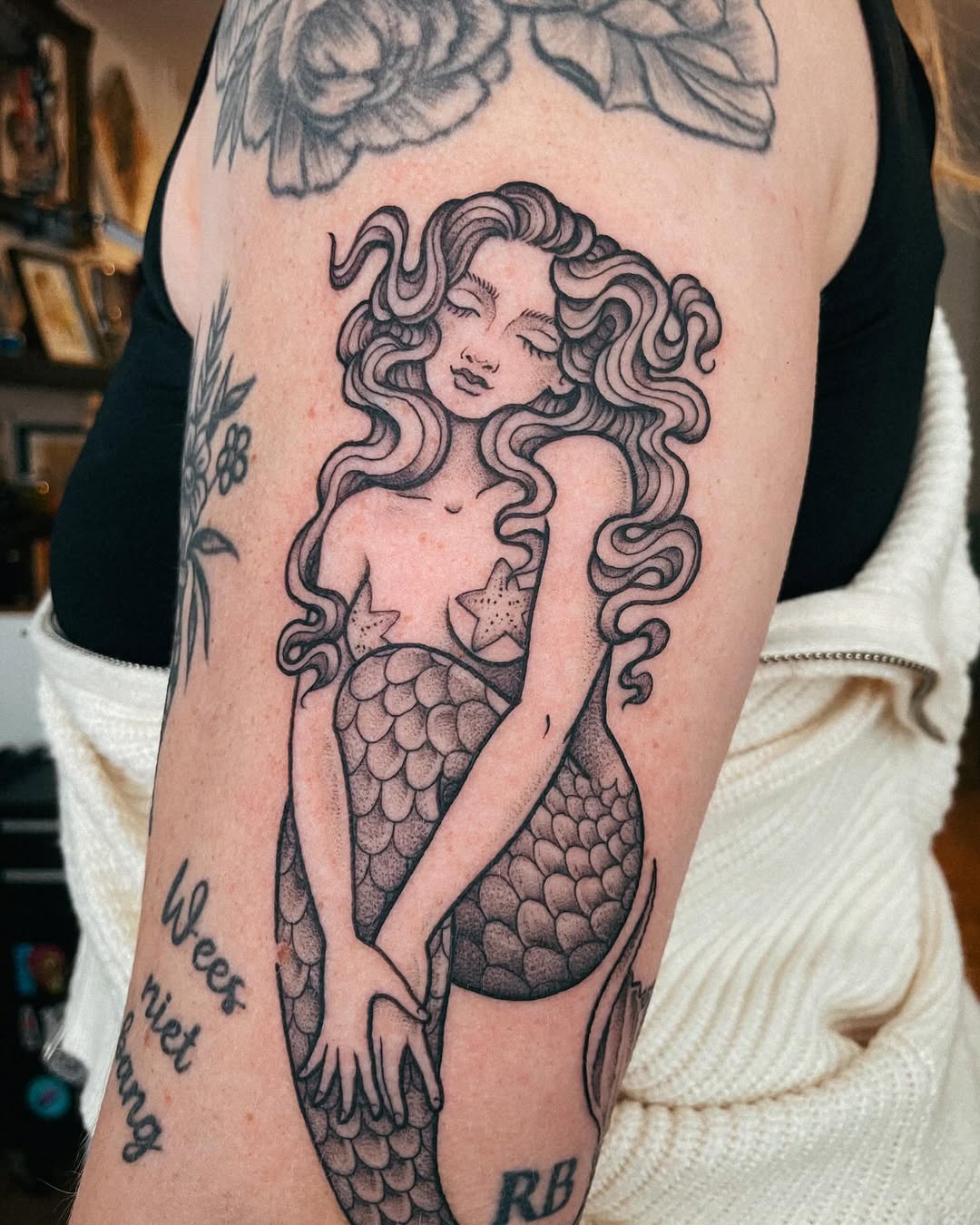 Stunning Mermaid Tattoo with Captivating Details