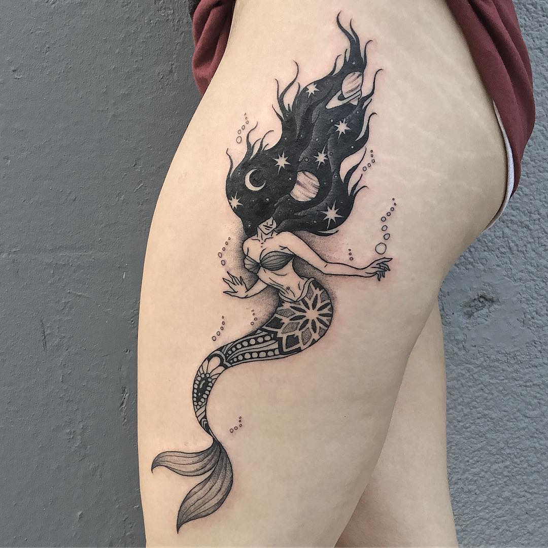 Enchanting Mermaid Tattoo with Stellar Elements