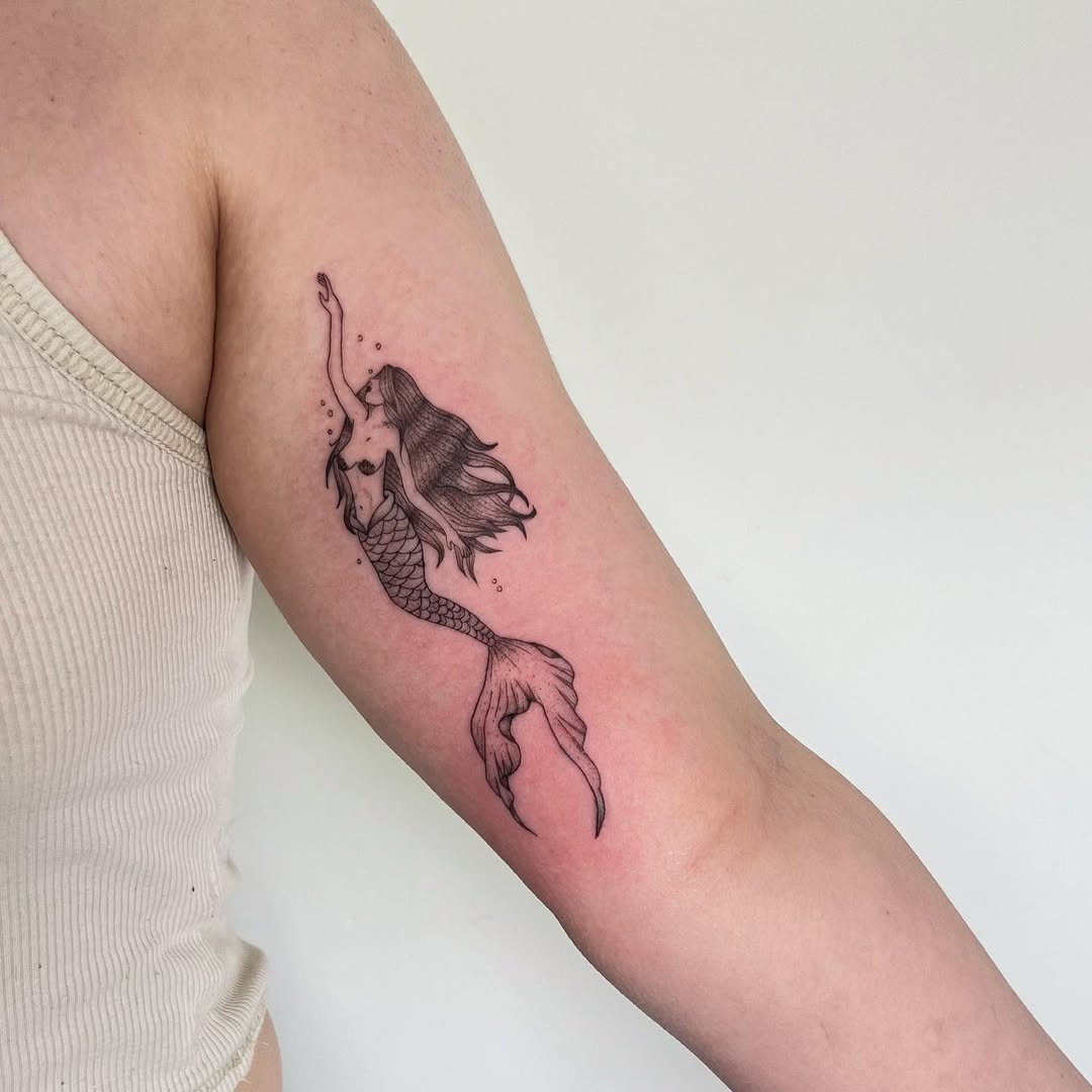 Elegant mermaid tattoo showcasing mythical allure