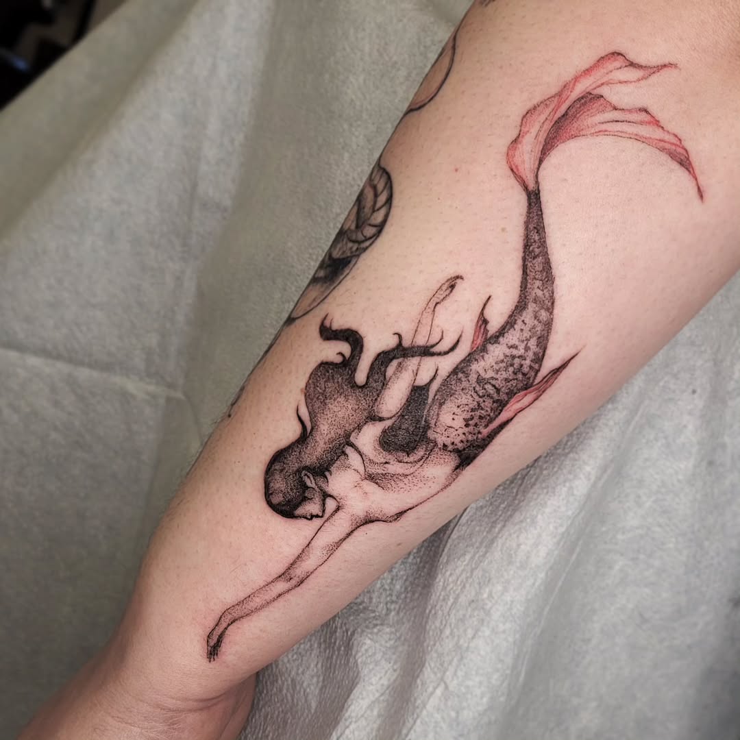 Elegant Mermaid Tattoo Gracing the Skin