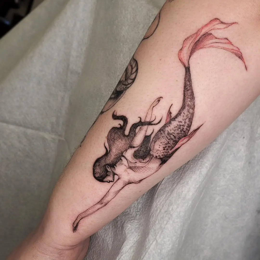 Elegant Mermaid Tattoo Gracing the Skin